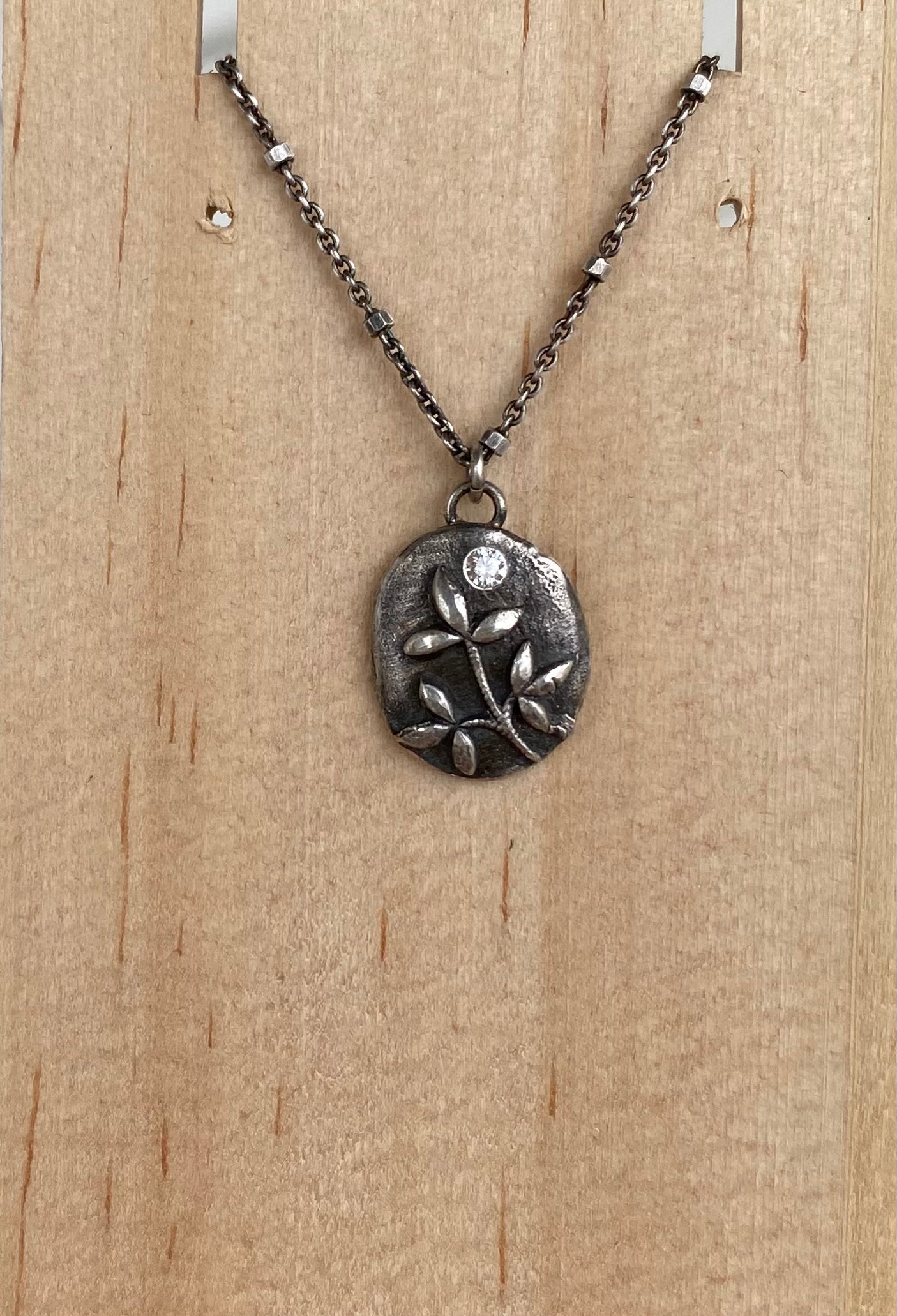 Sterling silver leaf pendant with clear CZ on 16”-18” chain