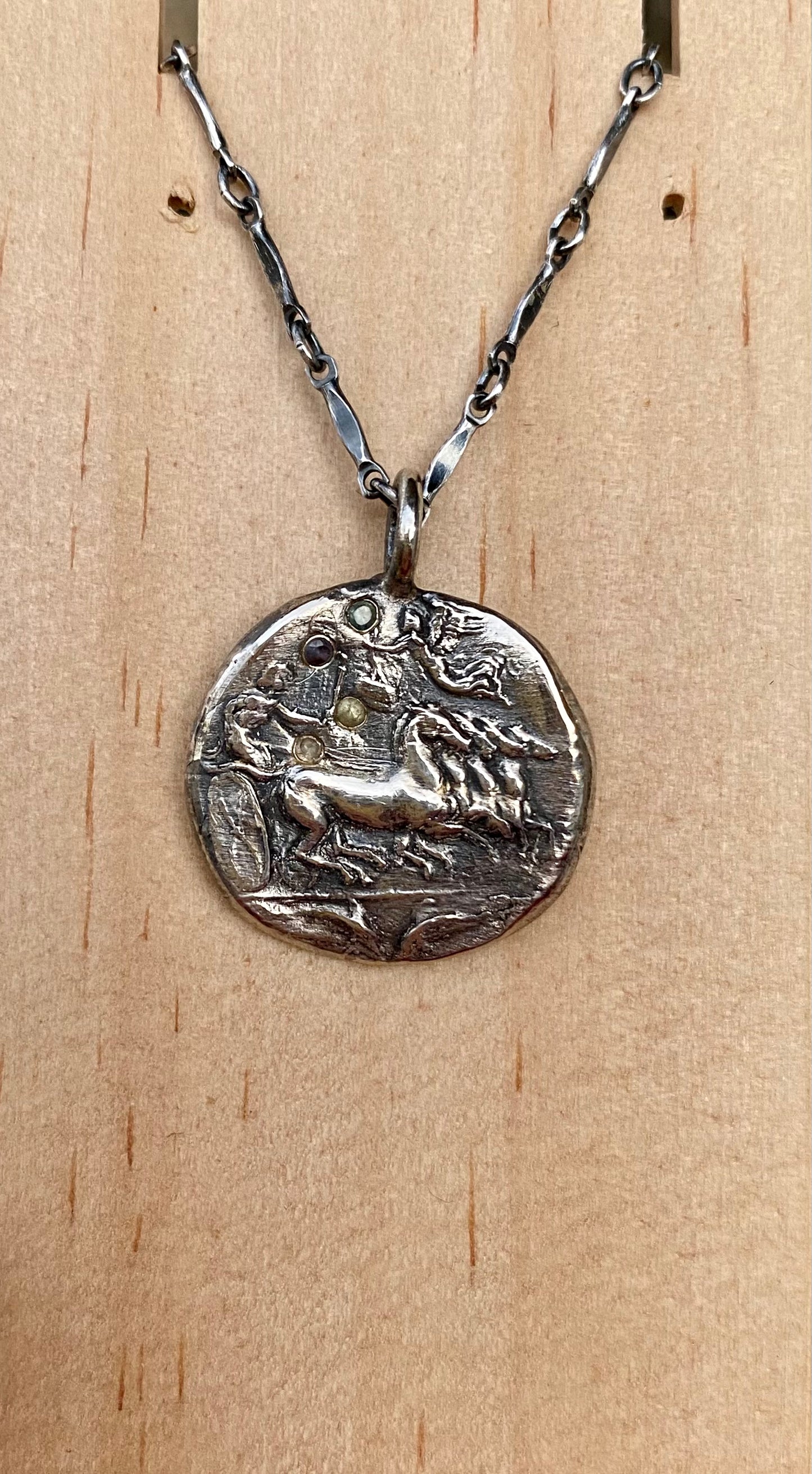 Sterling silver ancient coin with sapphires on 18” chain