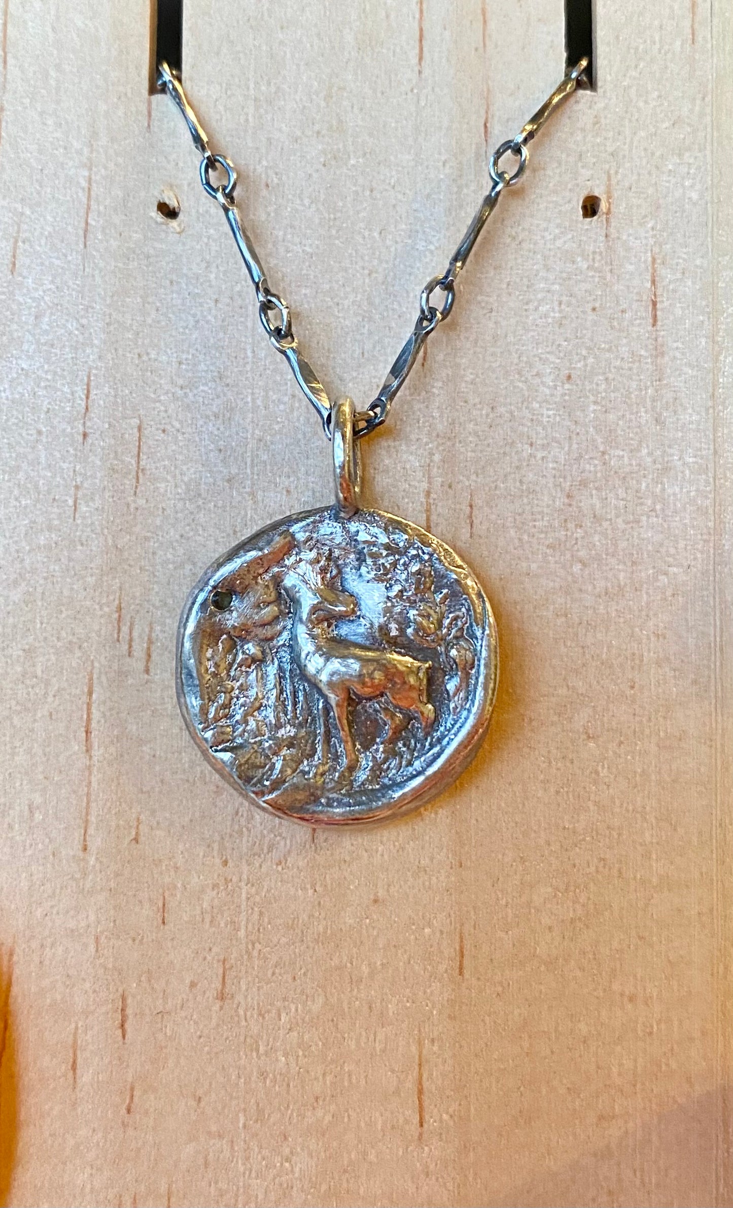 Sterling silver stag pendant with blue sapphire with 18” chain